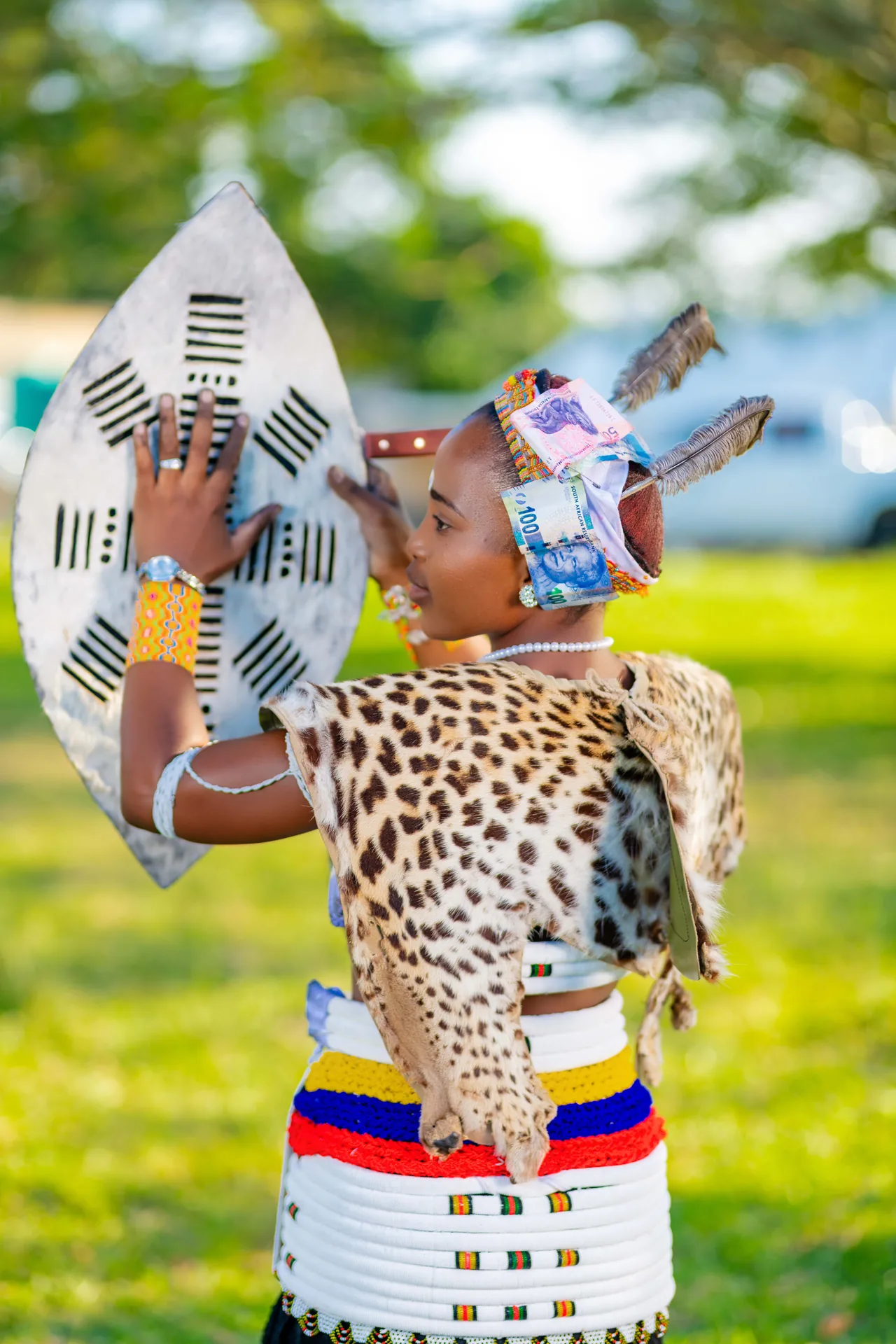 Bride in traditional attire at an outdoor celebration